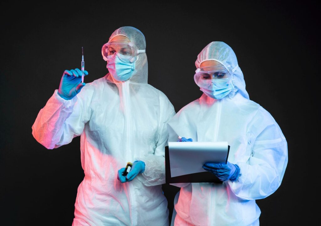 scientist team protective suit preparing tools