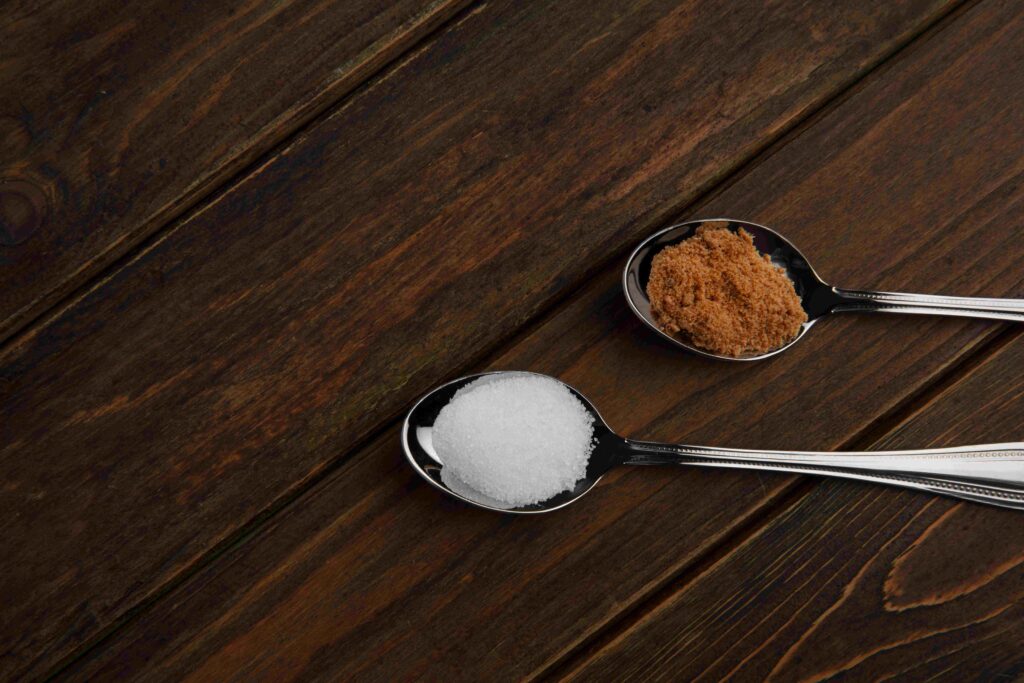 brown plate flour wooden spoon sugar 